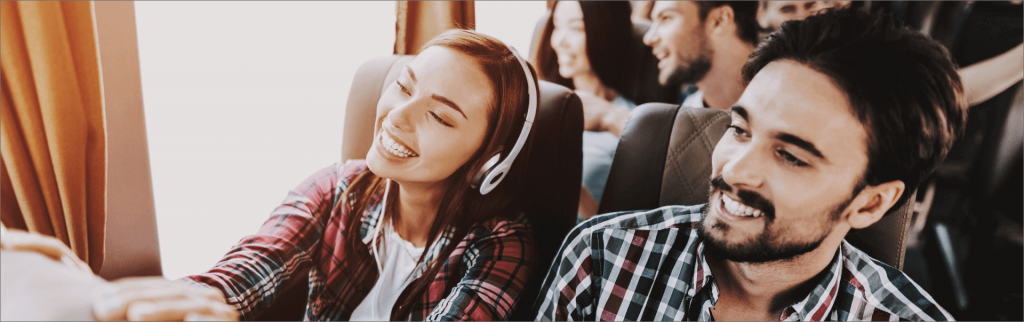 Group of happy tourist on bus